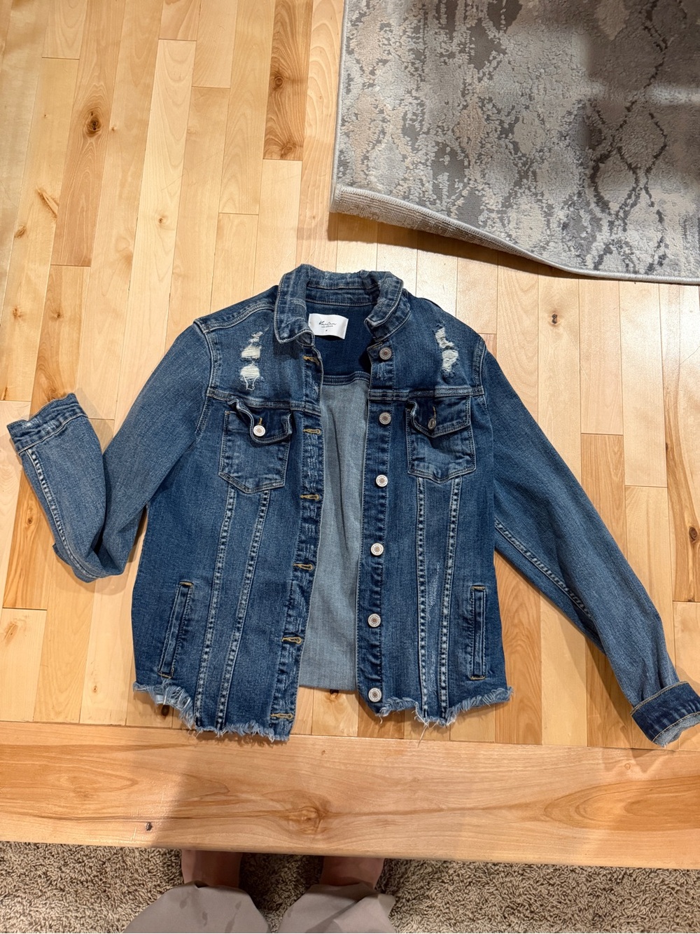 Distressed Blue Denim Jacket with Frayed Hem